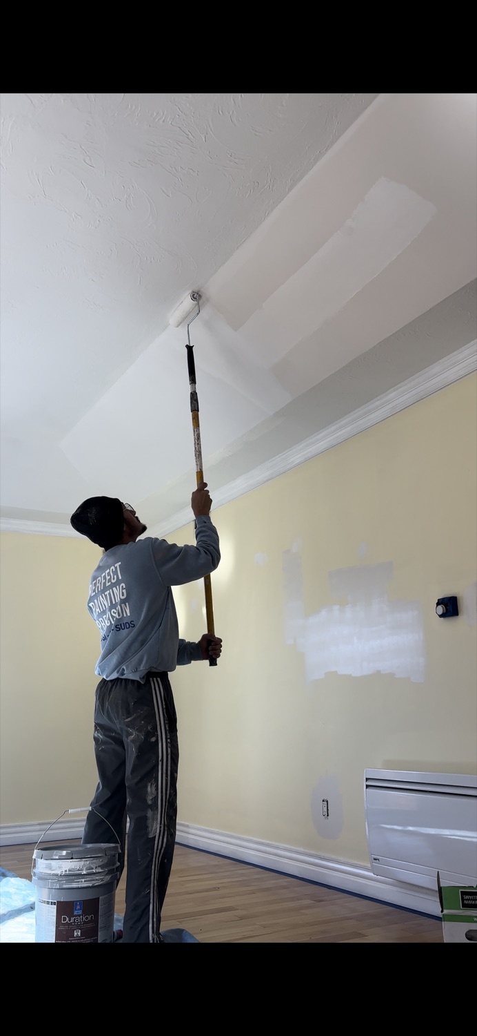 Brush Buds painting an interior ceiling and wall